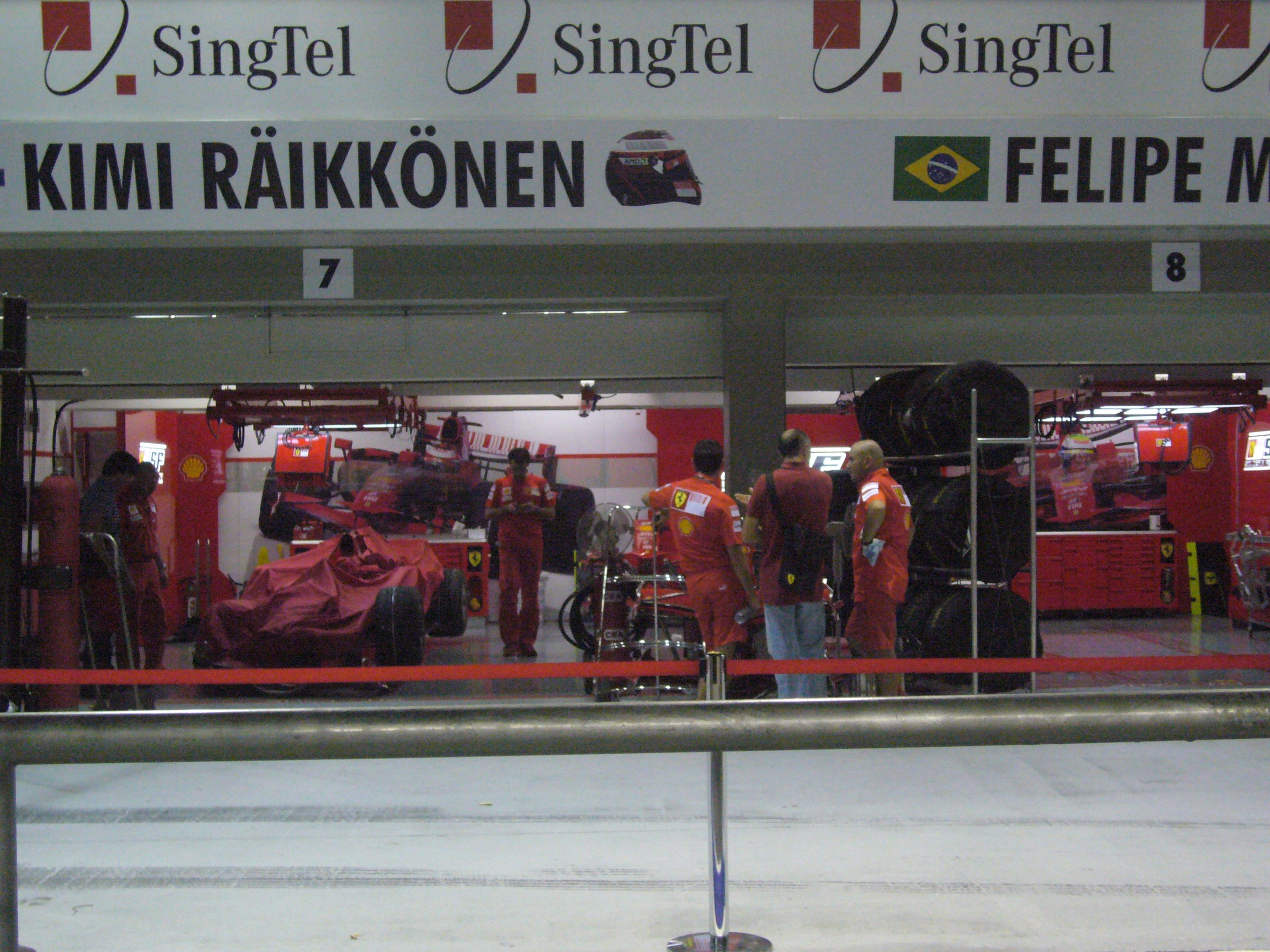 Formula 1 team mechanics at work in the garage