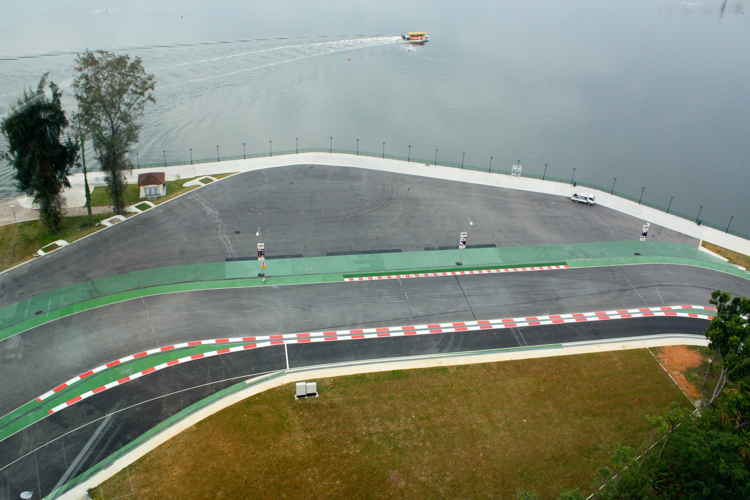 Aerial view of Marina Bay Street Circuit along the bay with the skyline behind it